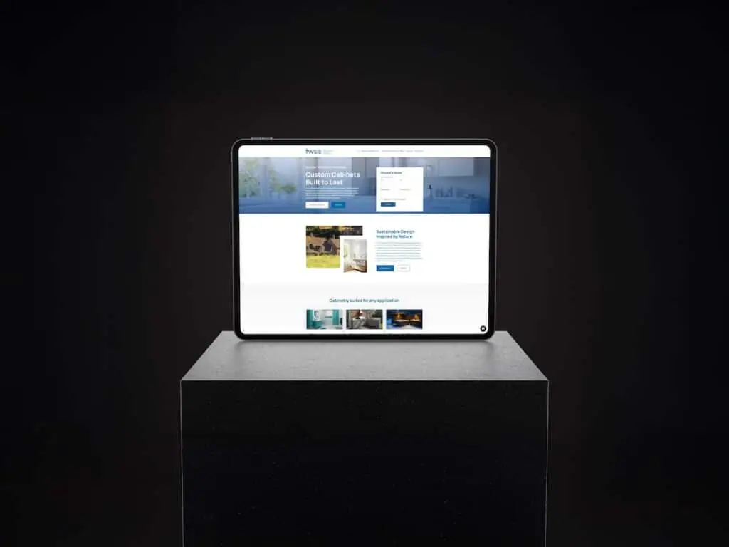 Tablet on a dark pedestal displaying a website mockup with a blue header and images on screen.
